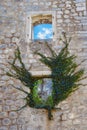 Wall of abandoned stone house on sunny day Royalty Free Stock Photo