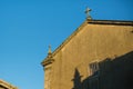 The wall of the ancient Catholic Church against the sky. Travel. Royalty Free Stock Photo