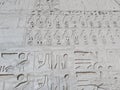 Wall at ancient Egyptian temple of Medinat Habu in Luxor Royalty Free Stock Photo