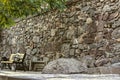 Wall assembled from preserved medieval fragments of stone crosses, carved ornaments and facade details on the territory of the Geg