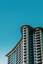 Wall With A Balcony Of New Empty Modern Multi-storey Residential Building House In Residential Area On Blue Sky