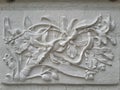 Wall bas-relief stucco in plaster, depicts flowers Lily.