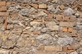 Wall with basalt blocks and bricks.