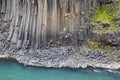 The wall of basalt columns in Studlagil canyon in Jokuldalur Valley in Iceland. Texture of a volcanic basalt rock Royalty Free Stock Photo