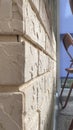 A wall with beige decorative tiles on the balcony Royalty Free Stock Photo