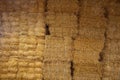 Wall of big bricks of hay in the barn Royalty Free Stock Photo