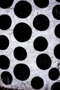 Wall of black polkadots on white background