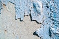 Wall blue grunge peeling paint on the old rough surface concrete background.