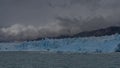 A wall of blue ice stretches in a glacial lake. Perito Moreno glacier. El Calafate. Argentina. Lago Argentino. Royalty Free Stock Photo