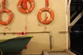 The wall of the boat station with lifebuoys at the sea pier