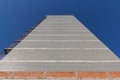 The wall of a brick building under construction. A look up. Blue Sky Background Royalty Free Stock Photo