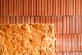 Wall of bricks and insulation wool. Building with cavity wall insulation. Close up. Royalty Free Stock Photo