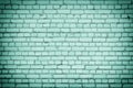 A wall of brightly colored turquoise bricks. Texture of even brickwork. Royalty Free Stock Photo