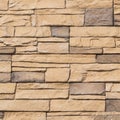 Wall of brown artificial stone Royalty Free Stock Photo