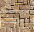 Wall with brown granite bricks