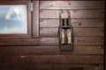 Wall of brown old boards with an old kerosene lantern Royalty Free Stock Photo