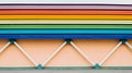 Wall of the building, supports in the form of pipes, and roofs illuminated in the form of a rainbow. Royalty Free Stock Photo