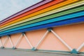 Wall of the building, supports in the form of pipes, and roofs illuminated in the form of a rainbow. Royalty Free Stock Photo