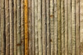 Wall built of different color logs. Old log texture. Vertical wooden log background Royalty Free Stock Photo