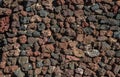 Wall built of lava remains or igneous rocks. Close-up