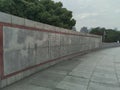 Wall of The Bund Historical Museum Tower in Shanghai, China with trees behind