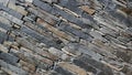 Wall of carefully stacked nature stone pieces.