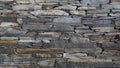 Wall of carefully stacked nature stone pieces.