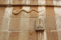 Wall carving of serpentsnake and a saint at Gomateshwara temple, Vindhyagiri, Shravanbelgola