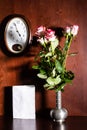 Wall clock, blank sheet of paper and pink roses Royalty Free Stock Photo