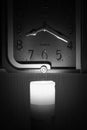 Wall clock lit by a candle Royalty Free Stock Photo