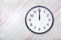 Wall clock on marble texture show twelve o`clock. Office clock show midday or midnight Royalty Free Stock Photo