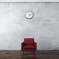 A wall clock and red chair Royalty Free Stock Photo