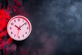 Wall Clock with Red Light Displayed Against Textured Dark Background with Rocks Royalty Free Stock Photo