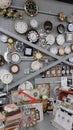Wall clock shop. Mechanical and electronic wall clocks on display wall in Hyper Karavan