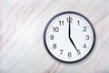 Wall clock show five o`clock on marble texture. Office clock show 5pm or 5am