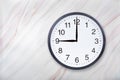 Wall clock show nine o`clock on marble texture. Office clock show 9pm or 9am