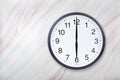 Wall clock show six o`clock on marble texture. Office clock show 6pm or 6am Royalty Free Stock Photo
