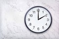 Wall clock show two o`clock on white marble texture. Office clock show 2pm or 2am Royalty Free Stock Photo