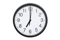 Wall clock shows time 7 o`clock on white isolated background. Round wall clock - front view. Nineteen o`clock