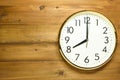 Wall clock on the wooden wall Royalty Free Stock Photo