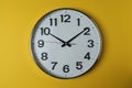 wall clock on a yellow Royalty Free Stock Photo
