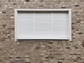 Closed window with rolling shutters or roller blinds Royalty Free Stock Photo