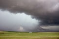 A wall cloud gathers underneath a supercell thunderstorm on the high plains of eastern Colorado. Royalty Free Stock Photo
