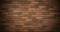 A wall composed of evenly arranged rectangular bricks in various shades of brown Royalty Free Stock Photo
