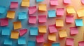 A wall covered in colorful sticky notes in yellow, pink, and blue Royalty Free Stock Photo