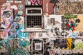 Wall covered in graffiti and wallpaper murals