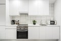 wall covered with white kitchen furniture with white silestone Royalty Free Stock Photo