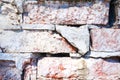 Texture of old rustic red brick wall painted with white. Close-up. Royalty Free Stock Photo