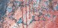 Wall crackled paint with blue and red pinkish