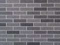 Wall decorated with bricks of different shades of gray Royalty Free Stock Photo